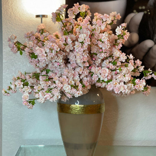 'Goddess' vase with pink cherry blossoms